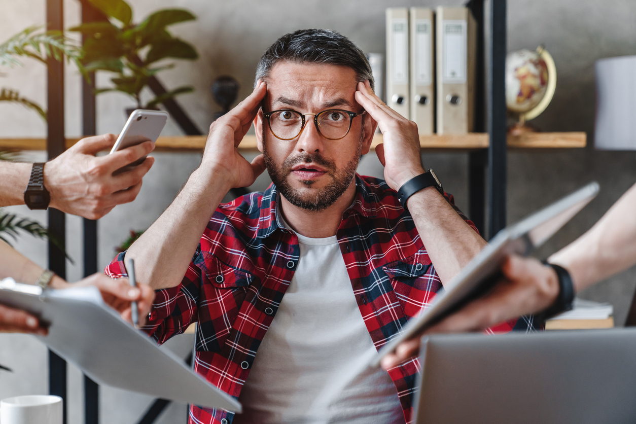 Man overwhelmed by technology
