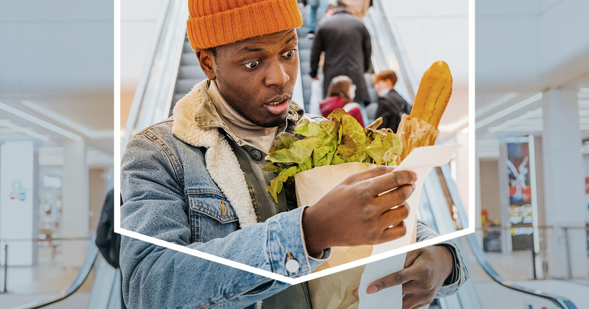 Man Looking at Grocery Receipt